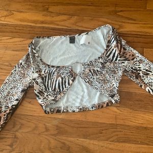Long sleeve tiger and cheetah print cropped top with ring.